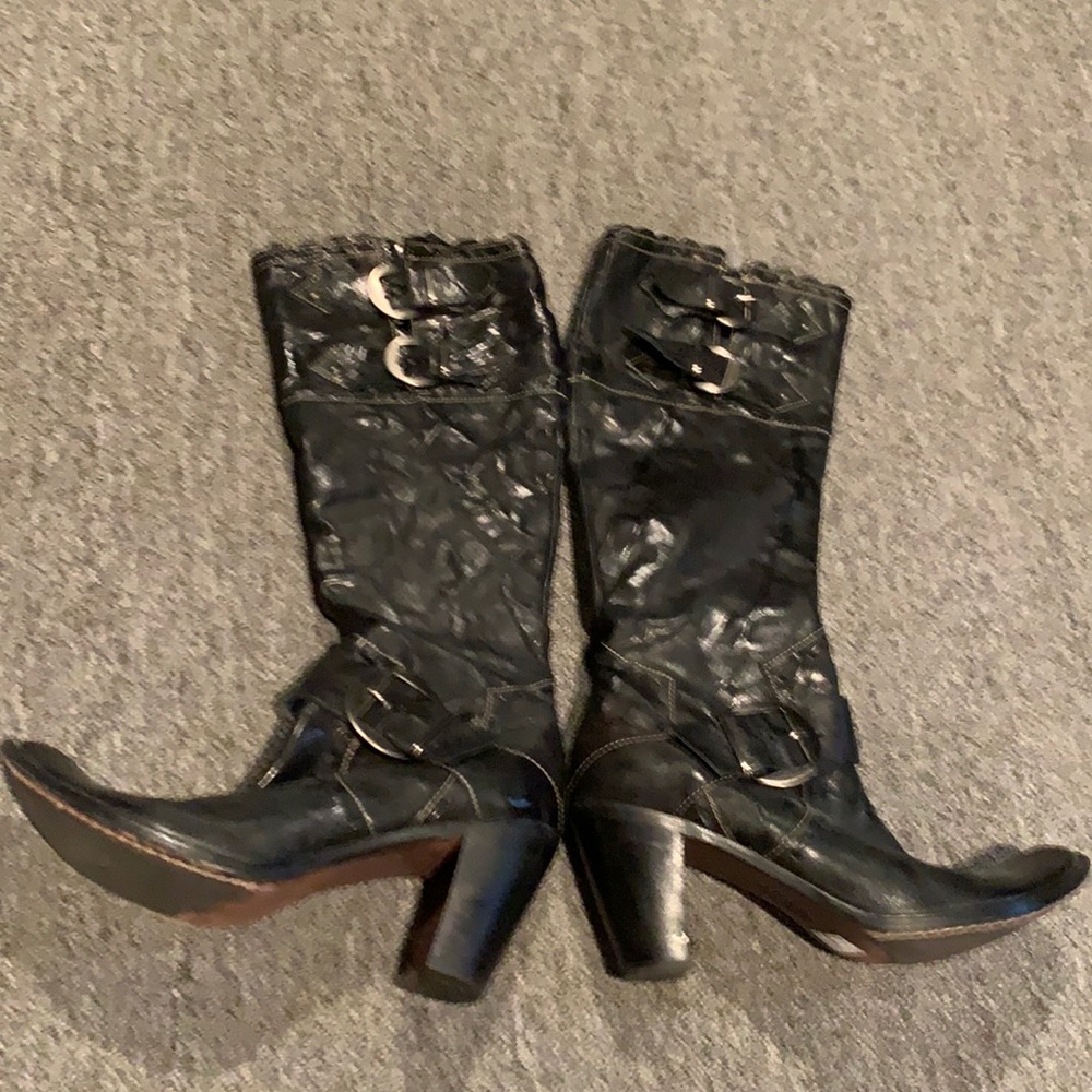 Black leather boots with a high heel